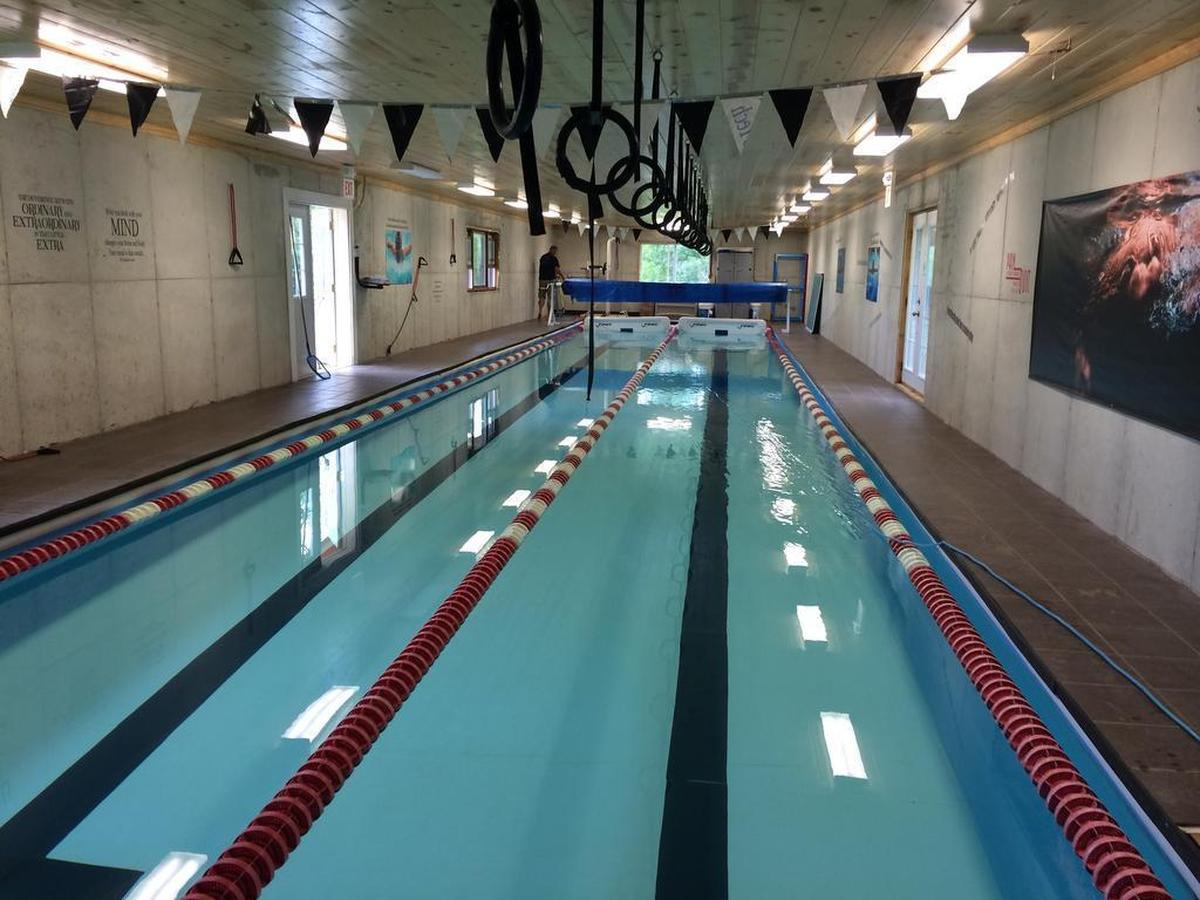 The two-lane indoor pool where Michael Andrew trains is in the backyard of his family’s house just outside Lawrence.