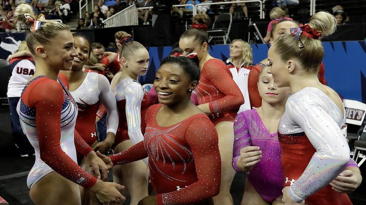 Simone Biles (center) gathered with other competitors after the women’s U.S. Olympic gymnastics trials Sunday in San Jose, Calif.