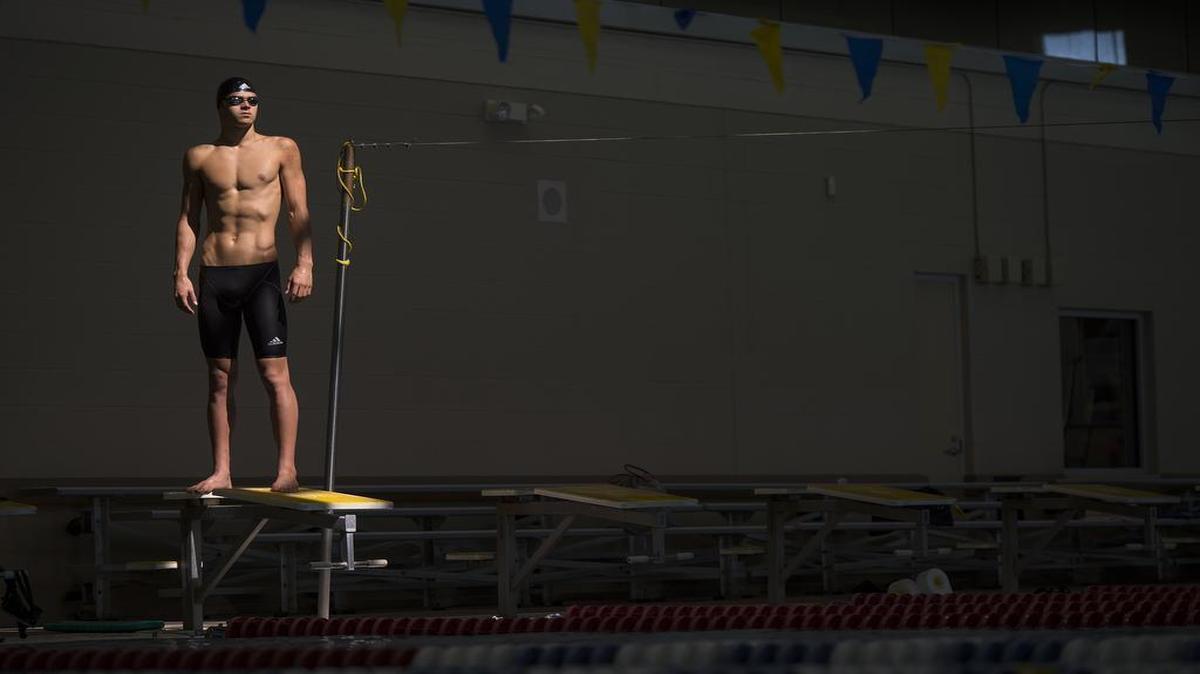 
Michael Andrew, a 16-year-old professional swimmer who lives just outside of Lawrence with his family, is training with the eventual goal of qualifying for the 2016 Rio Olympic Games. Andrew, who normally trains at a 25-meter, two-lane pool built at his home, was training at the Lawrence Aquatic Center while his home pool water was being treated.
