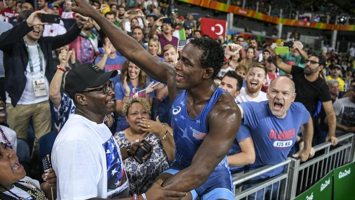 United States wrestler J'den Cox climbed into the crowd to greet his family following his bronze medal victory in the men's freestyle 86kg on Saturday at Carioca Arena 2 during the 2016 Summer Olympics Games in Rio de Janeiro, Brazil.
