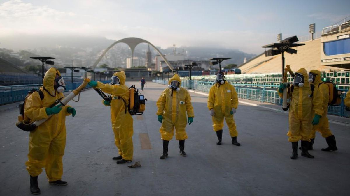 Health workers prepare to spray insecticide to combat the mosquitoes that transmit the Zika virus at the Sambadrome in Rio de Janeiro, which will be used for the Archery competition in the Olympics.