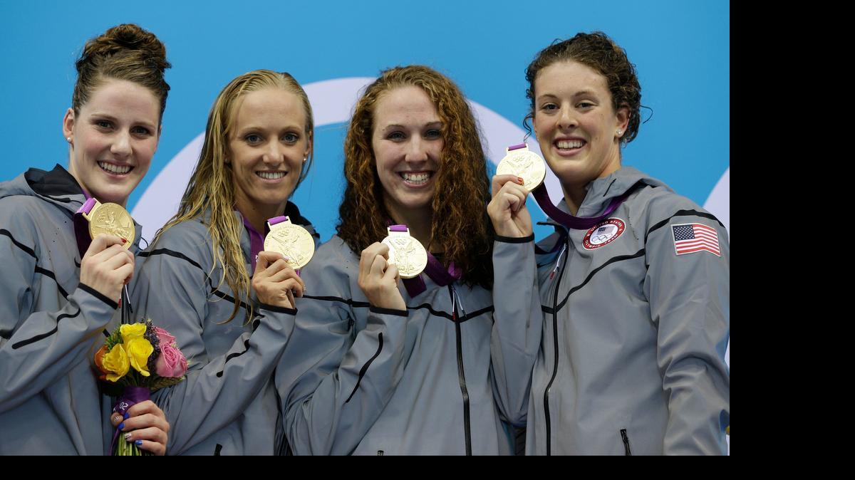 
From left, United States' Missy Franklin, United States' Dana Vollmer, United States' Shannon Vreeland and United States' Allison Schmitt pose with their gold medals for the women's 4x200-meter freestyle relay swimming final at the Aquatics Centre in the Olympic Park during the 2012 Summer Olympics in London, Wednesday, Aug. 1, 2012. 
