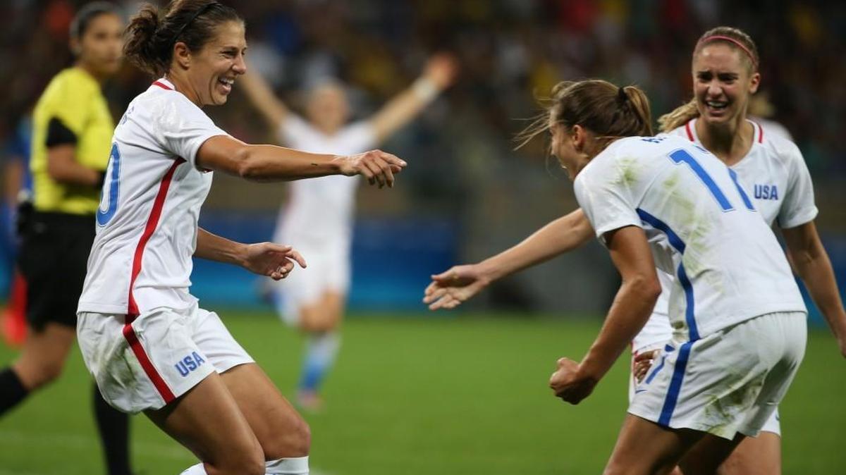 Carli Lloyd (left) celebrates her goal with teammates during the United States’ 1-0 win over Grance in Group G of the women’s Olympic soccer tournament in Belo Horizonte, Brazil.