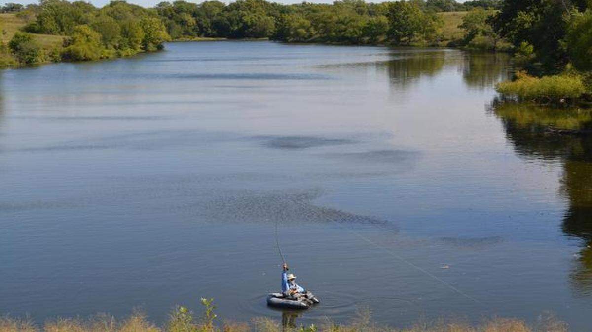 Fishing in the beauty of the Kansas Flint Hills, Bill Hartman used a fly rod and an assortment of flies to battle big bluegills on a friend’s farm pond.