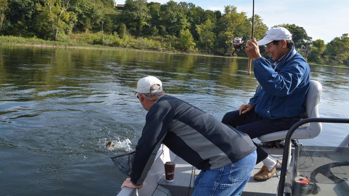 
Shoji Tabuchi fell in love with the Ozarks area years ago and has yet to grow bored with the fishing. The legendary Branson entertainer fought a rainbow trout recently at Lake Taneycomo, while guide Chuck Gries reached out to net the catch.


