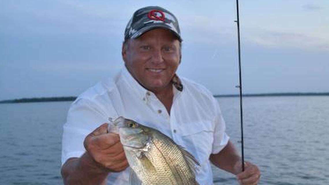 
Gene Pearcy, a guide on Grand Lake, displayed one of the white bass he caught near sundown Tuesday.
