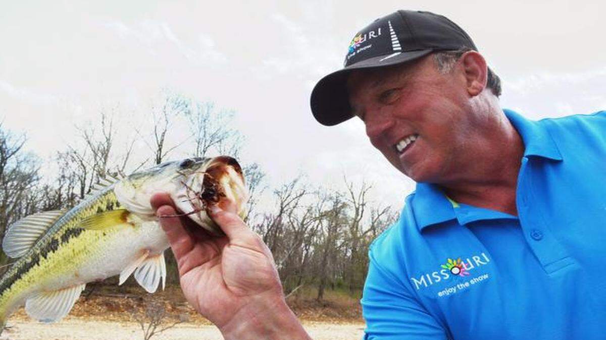 
Scott Pauley with the Missouri Division of Tourism knows there are many largemouth bass to be caught this time of year, especially in places like Stockton Lake. He admired one of his catches at the late Thursday. 
