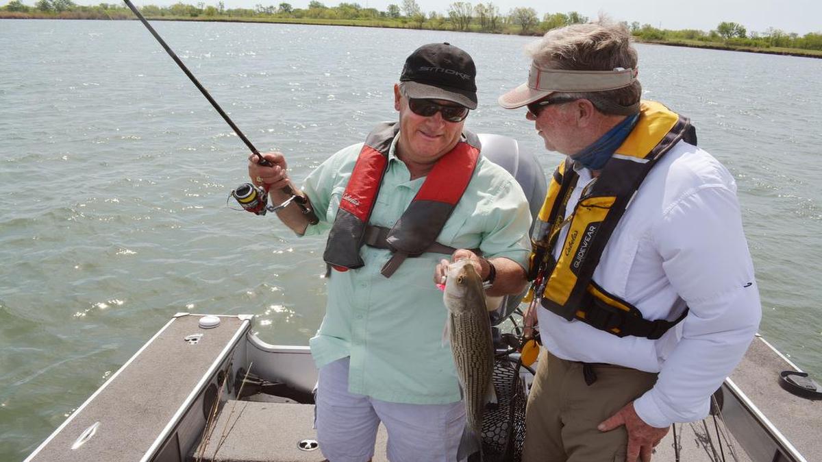 
Clyde Holscher (right) congratulated Dennis Horner after he caught a wiper at Coffey County Lake on a recent trip.
