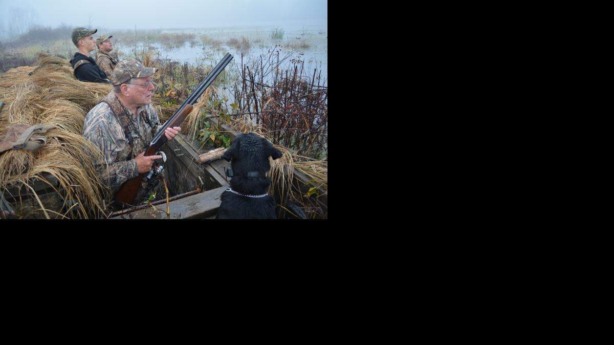 
Jeff Churan (foreground), his grandson Luke (center) and his son John carried on a family tradition Saturday, opening the Missouri duck season at the family’s hunting camp near Chillicothe.
