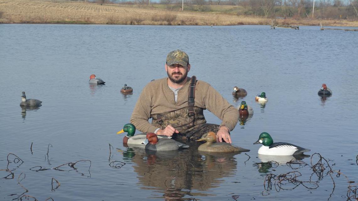 When Tom Modin of Kearney goes duck hunting, he is surrounded by his own artwork — decoys he has carved and hand-painted.