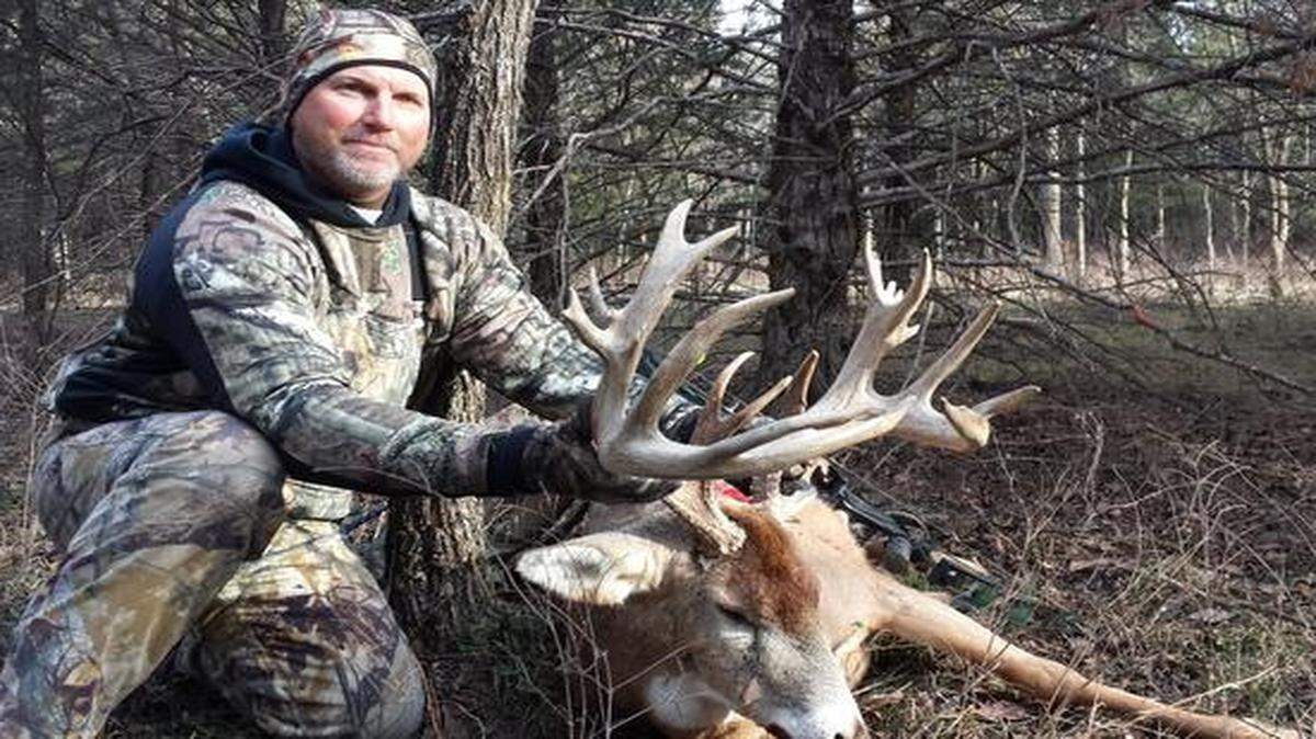 
Todd Gast with a 15-point buck he shot Monday.
