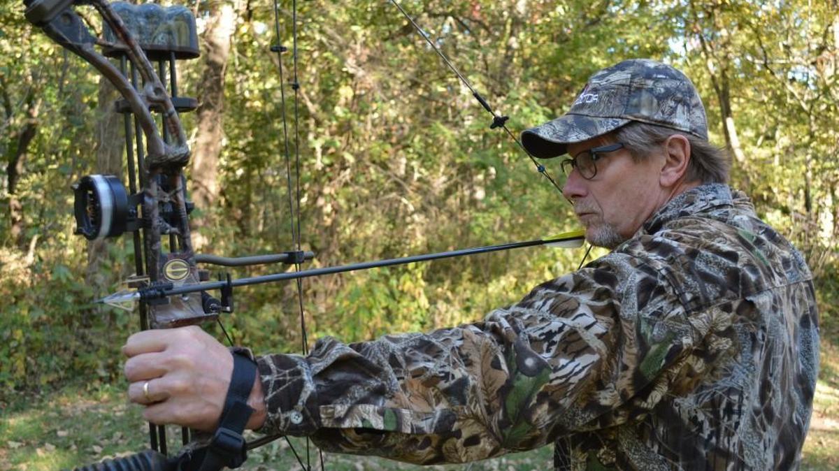 
Dennis Steinman of Lecompton, Kan., takes target practice with his tiny game-retrieval system attached to an arrow. The wireless unit's module pierces the hide of the deer when the deer is hit, helping the hunter track his game.
