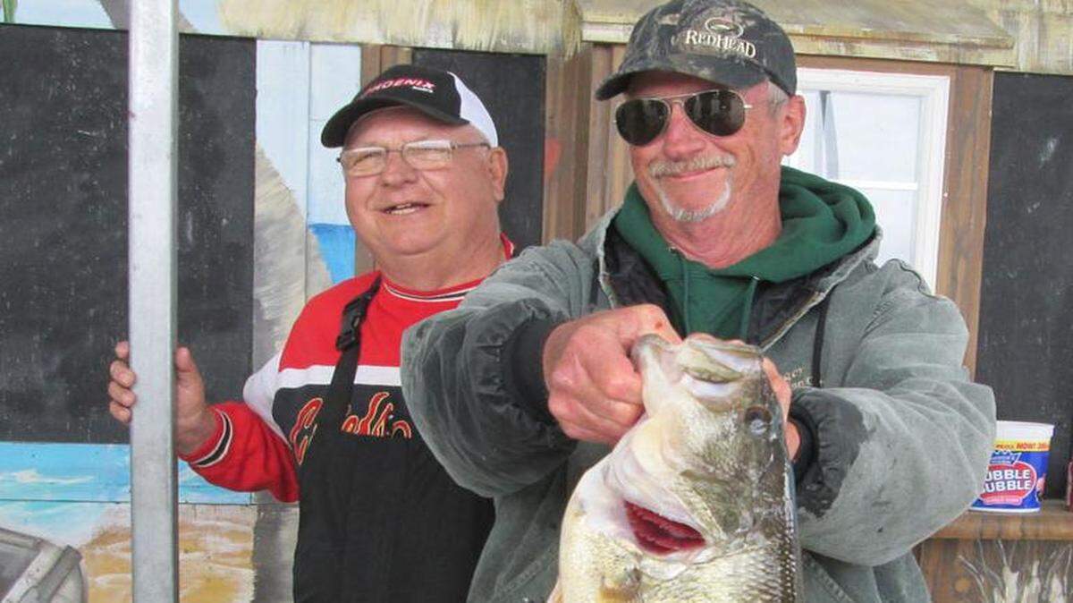
Harry Carr (right) posed with the 9-pound, 4-ounce bass he caught Sunday in a tournament at Smithville Lake.


