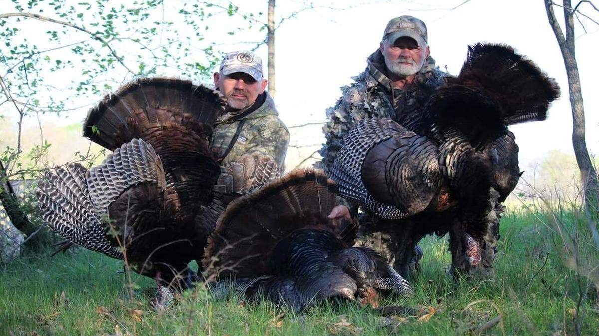 
Brett Stephenson (left) and Dan Guyer posed with their turkeys and the bird that a friend, Fred McAdams, shot on opening day of the Missouri season.
