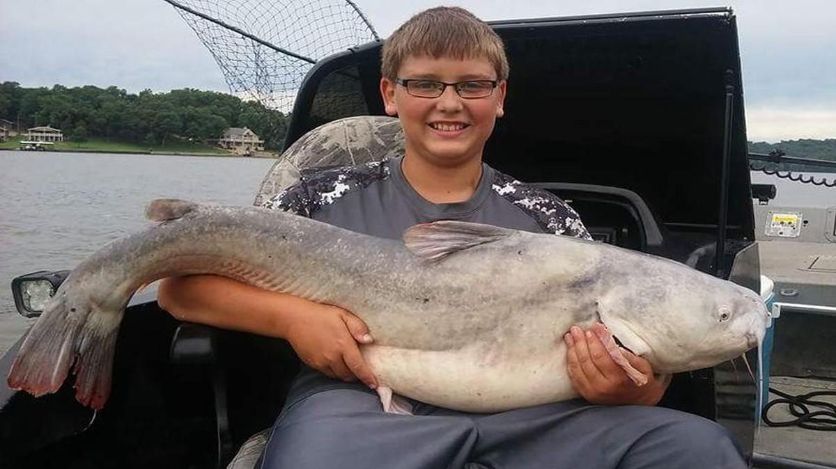 Philip Hilker had good reason to smile after catching a big blue catfish while fishing with guide Chris Jones at Lake of the Ozarks.