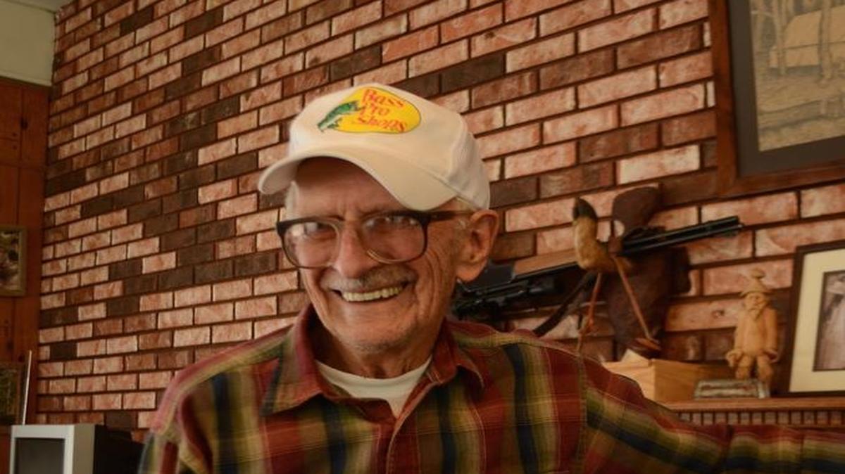 Dale Searcy displayed one of the homemade turkey calls he has been carving since the early 1960s.