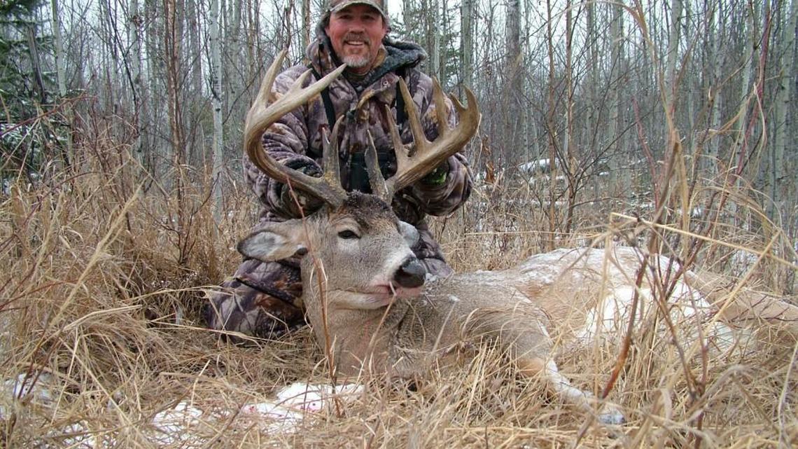 Ned Yost with a deer he harvested