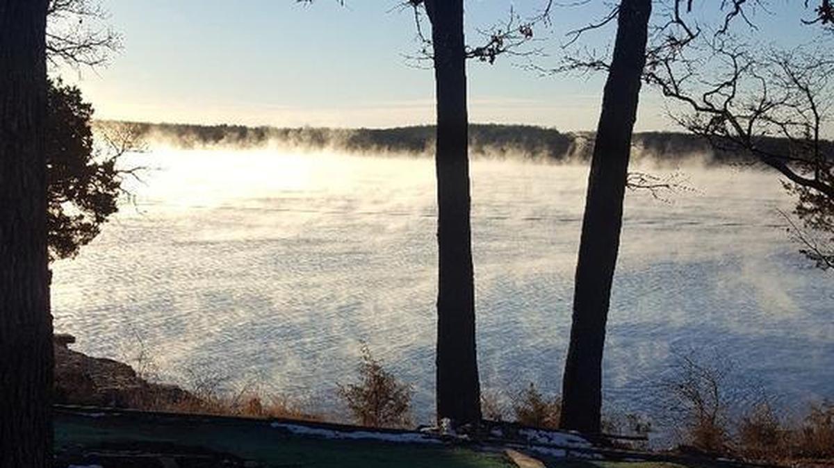 Mist rises from Pomme de Terre Lake on Wednesday morning as frigid temperatures swept across the Heartland. The phenomenon, sometimes called steam fog, occurs when cold, dry air moves over a body of water, mixing with warmer, moister air rising off the water’s surface.