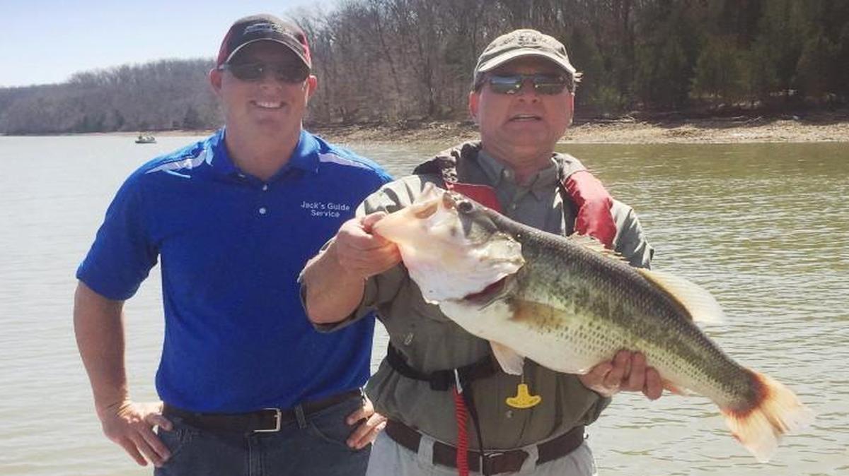 Val Grikis of Austin, Texas (right) displayed the 10-pound, 11-ounce bass he caught on March 15 at Lake of the Ozarks. He was fishing with his son Ryan and guide Jack Uxa (left).