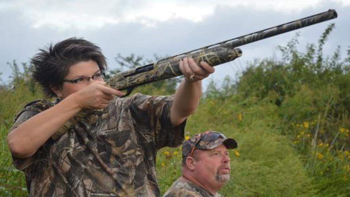 
Jenny Moss aimed at a dove flying across a field on the Poosey Conservation Area in north-central Missouri as her husband, Mark, looked on. Moss was participating in a special event designed to introduce adults and youth alike to hunting.
