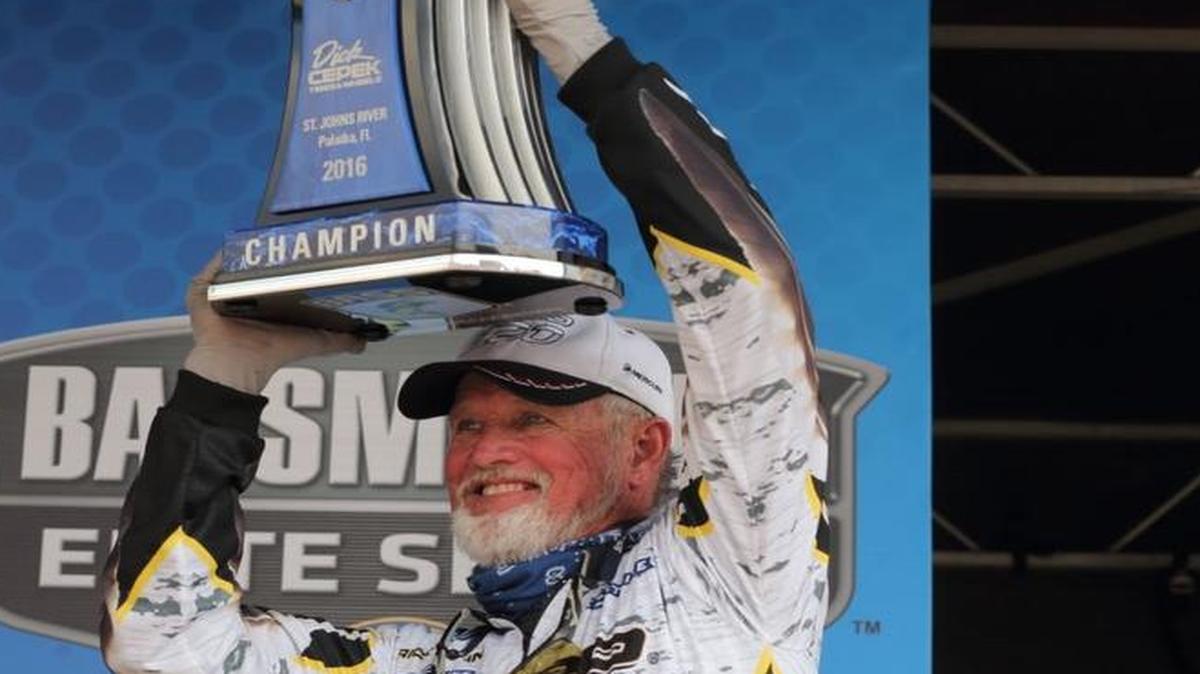 Rick Clunn of Ava, Mo., held up a trophy he won Sunday at an Elite Series tournament on the St. Johns River in Florida