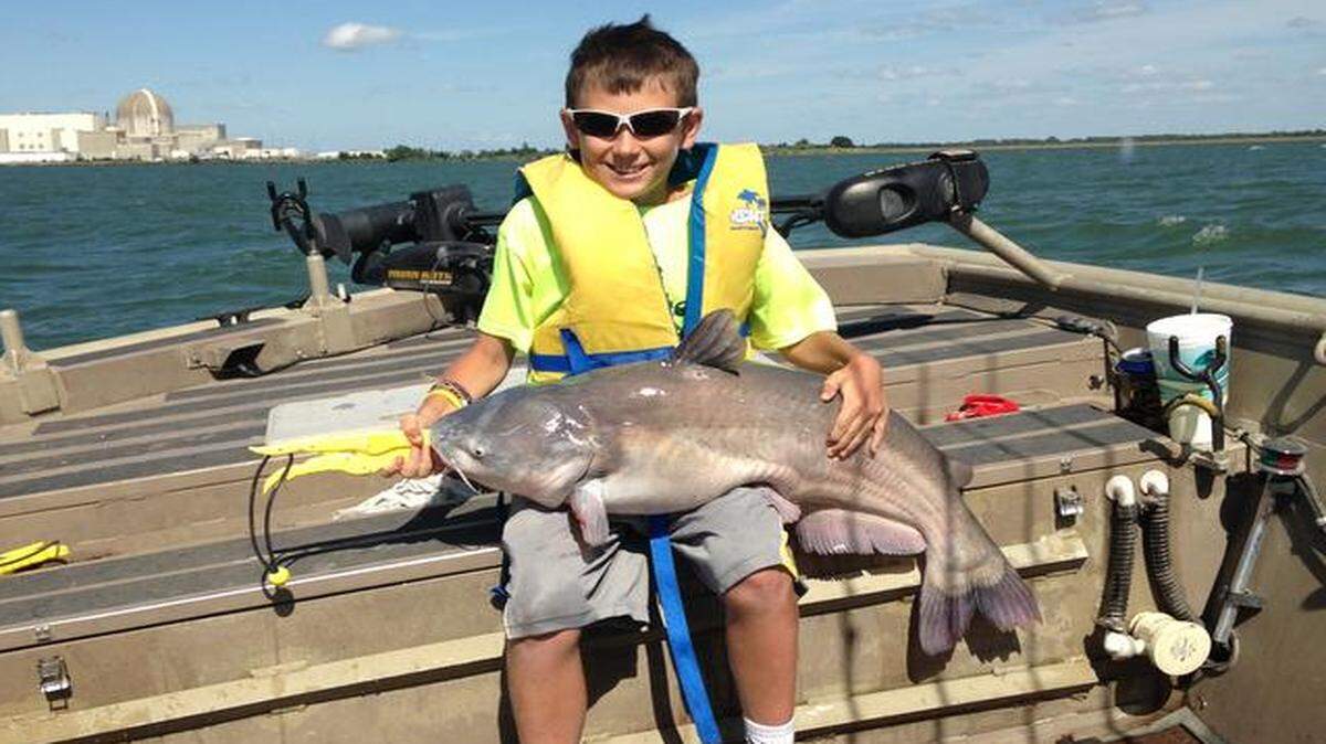 
Daven Wolf, 11, of Olpe, Kan., posed with the 26-pound blue catfish he caught at Coffey County Lake.
