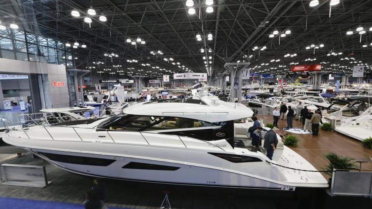 
Patrons passed a yacht on display at the Sea Ray & Meridian booth during the New York Boat Show on Jan. 21 in New York.
