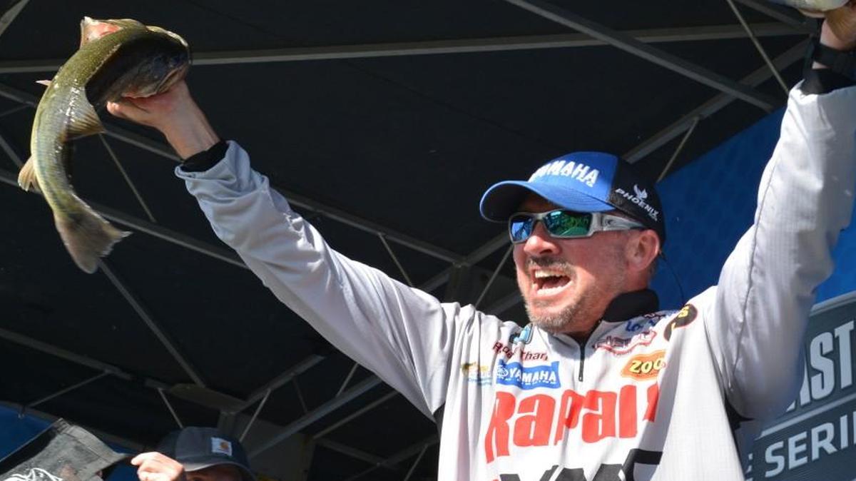 Randall Tharp showed the crowd two of the bass that helped him win the Bassmaster Elite national tournament Sunday at Norfork Lake.