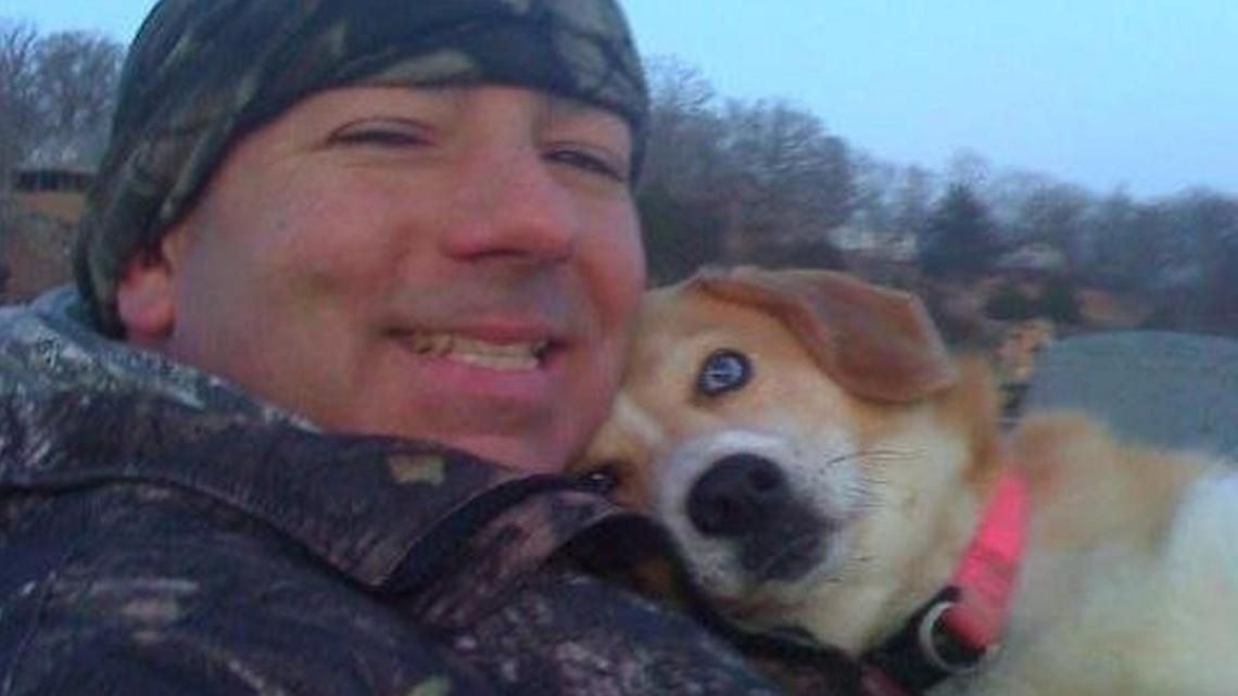 Chris Jones with his fishing dog Angel, who passed away last year.
