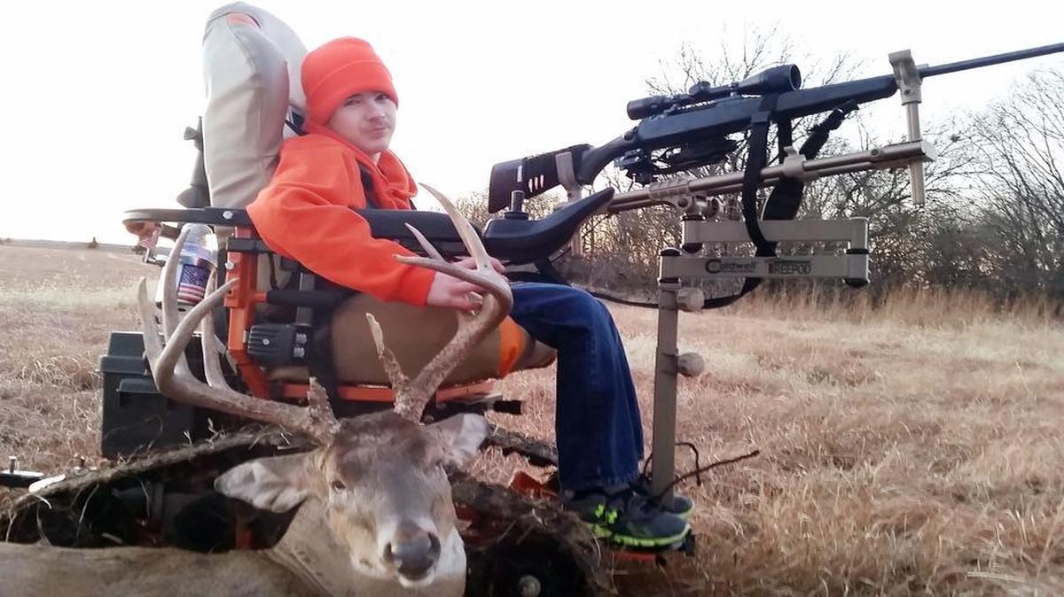 Brayden Hugunin of Burlington, Kan., posed with the trophy buck he shot in December while sitting in his all-terrain wheelchair. Hugunin, who has cerebral palsy, is unable to walk.