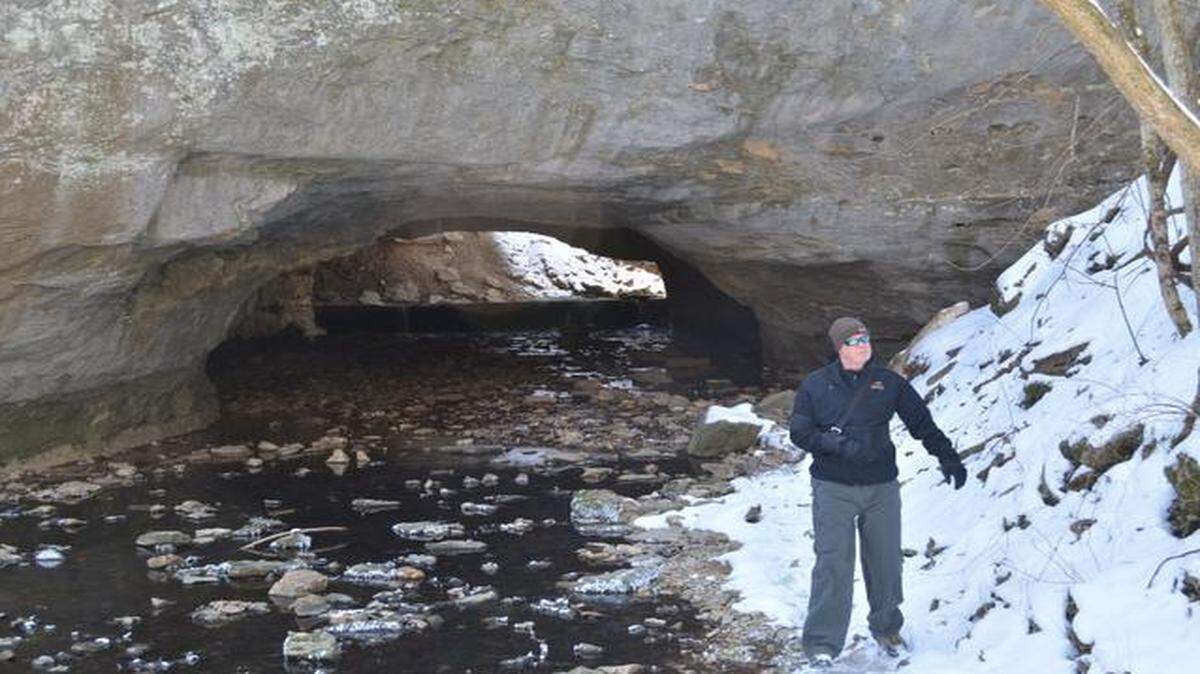 
Bill Bryan explored a creek running under the natural bridge at Rock Bridge Memorial State Park near Columbia, Mo.
