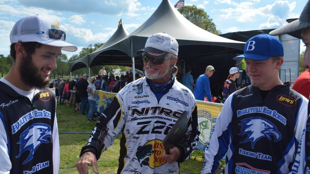 Pros fisherman Rick Clunn (center) joked with members of the Bradleyville, Mo., high-school bass fishing team after they presented him with an award following the second round of the Bassmaster Elite tournament at Bull Shoals and Norfork lakes.