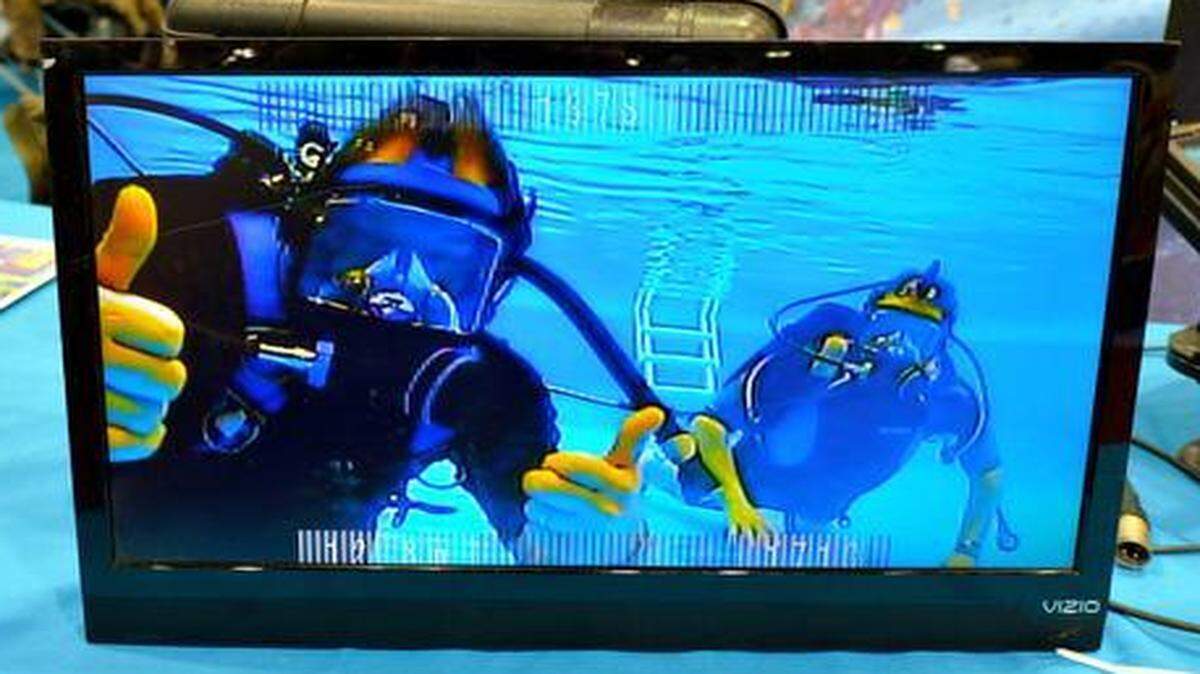 
Dave Reidenbach (left) and Ben Morris are shown on a video monitor that was recording them in the “Be A Diver” pool at the Kansas City Boat and Sportshow.
