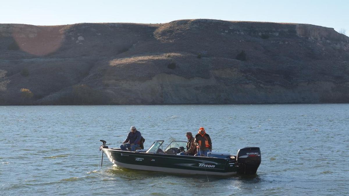 Louie Konrade, his brother Gary and Phil Taunton (from left) fished for walleyes and white bass on Clark State Fishing Lake in southwestern Kansas.