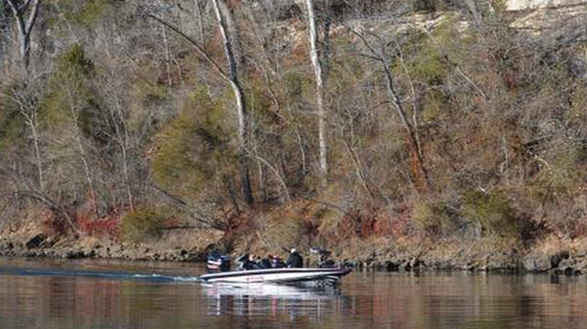 
The cold of winter can produce hot trout fishing at Lake Taneycomo. On a recent weekday, a boat was dwarfed by a bluff as fishermen made their way downstream.
