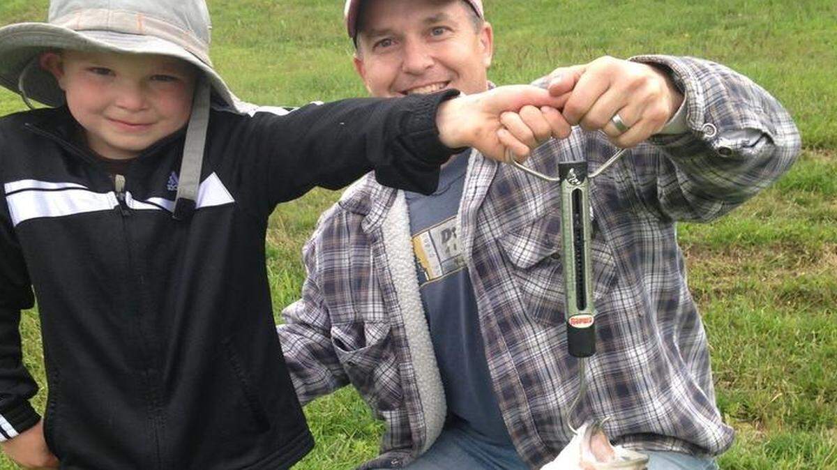 
Corbin Brennan and his dad, Joe, displayed the 8-pound wiper Corbin caught recently at Shawnee Mission Lake.
