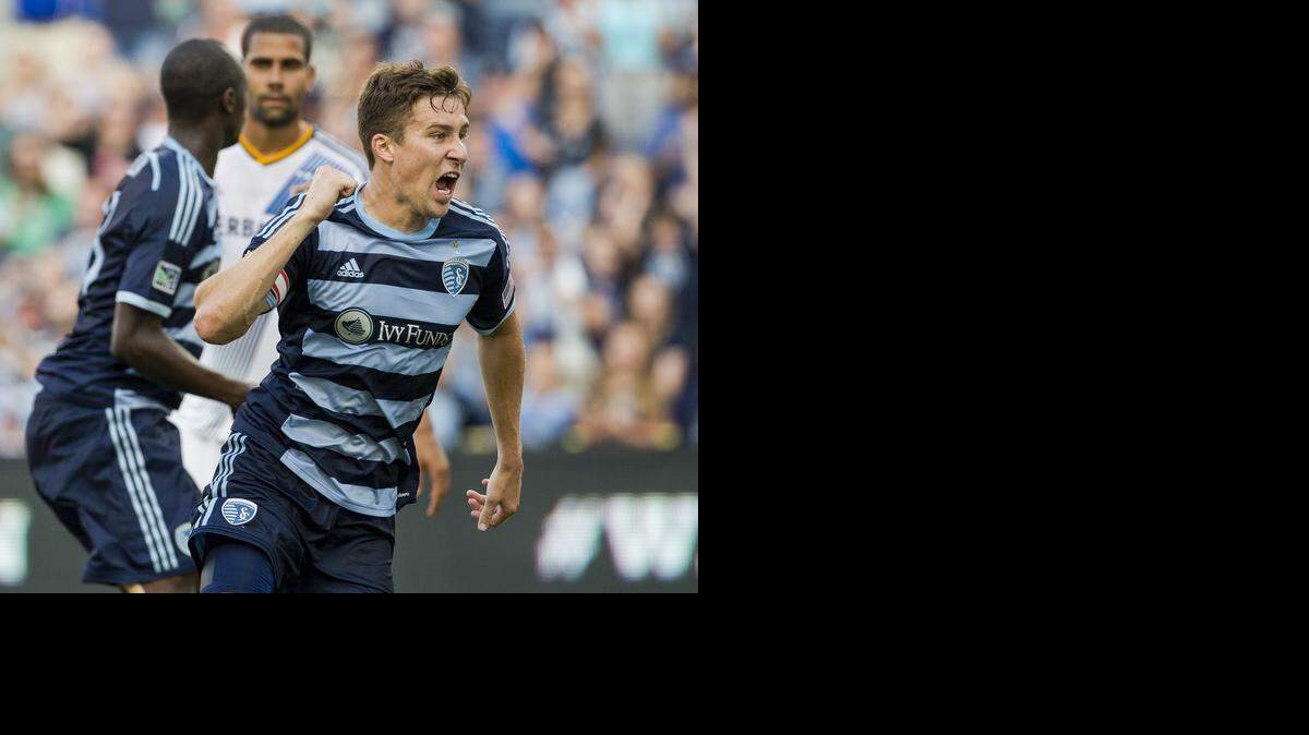 
Matt Besler (5) of Sporting Kansas City starts his celebration after Lawrence Olum (13) of Sporting Kansas City scored a goal against the LA Galaxy during game action on Saturday, July 19, 2014, at Sporting Park in Kansas City, Kan.
