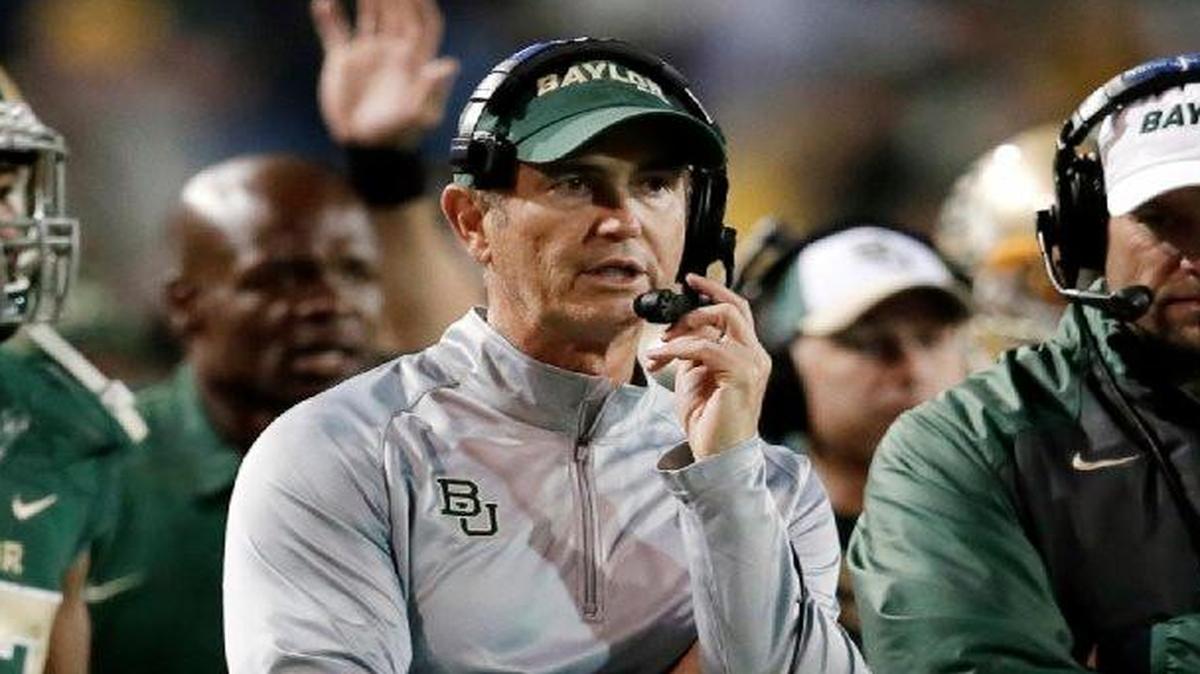 Baylor football coach Art Briles (center) lost his job amid allegations of sexual assaults and violence by football players against Baylor students and the school’s mishandling of the incidents.