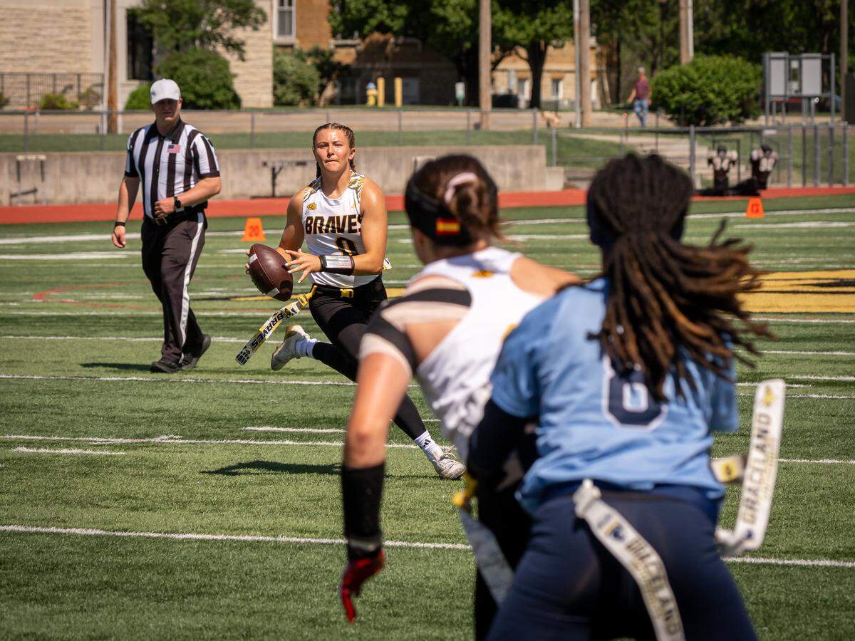 Park Hill High alum Anna Anderson (center, #0) won the KCAC Player of the Year as a freshman quarterback for Ottawa. She chose the school because of its unprecedented success and the way they welcomed her on her visit.