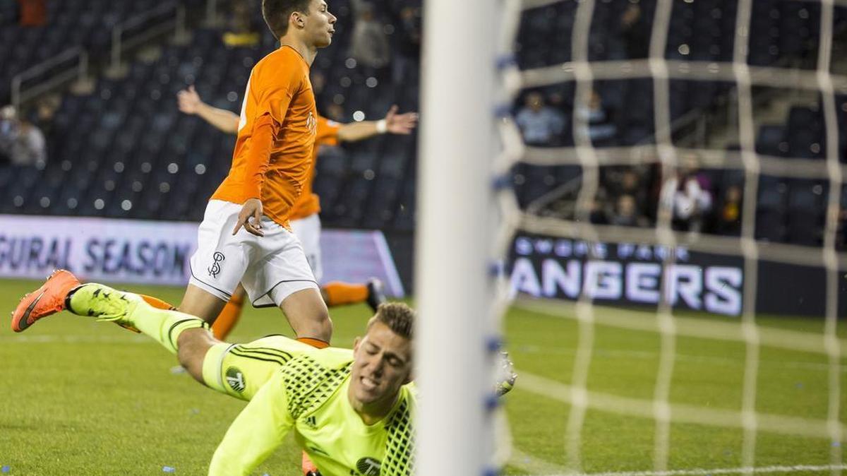 Daniel Salloi (30) of the Swope Park Rangers starts his celebration after scoring a goal against Wade Hamilton (35) of the Portland Timbers 2 during the home opener for the Swope Park Rangers on Saturday, March 26, 2016 at Children's Mercy Park in Kansas City, Kansas.