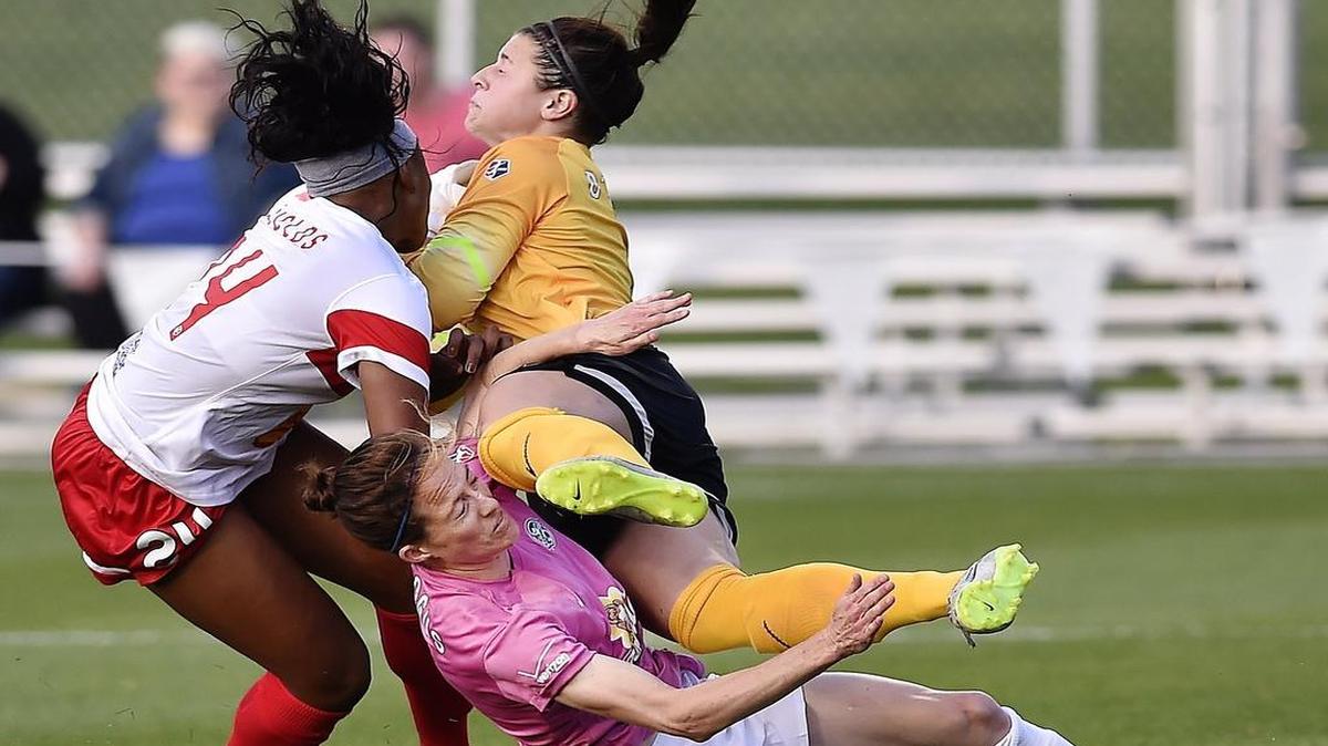 
FCKC's Liz Bogus (5), WNY's Jamia Fields (24) and WNY goalkeeper Sabrina D'Angelo collide Thursday as D'Angelo makes a first-half save, sending Bogus and D'Angelo out of the game. Bogus received treatment and returned.

