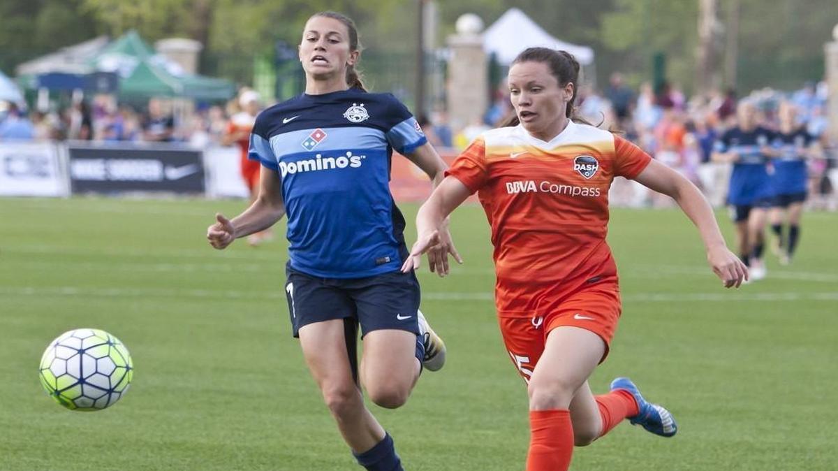 FC Kansas City midfielder Mandy Laddish (left) and Houston defender Allysha Chapman tried to gain control of the ball during a match Saturday