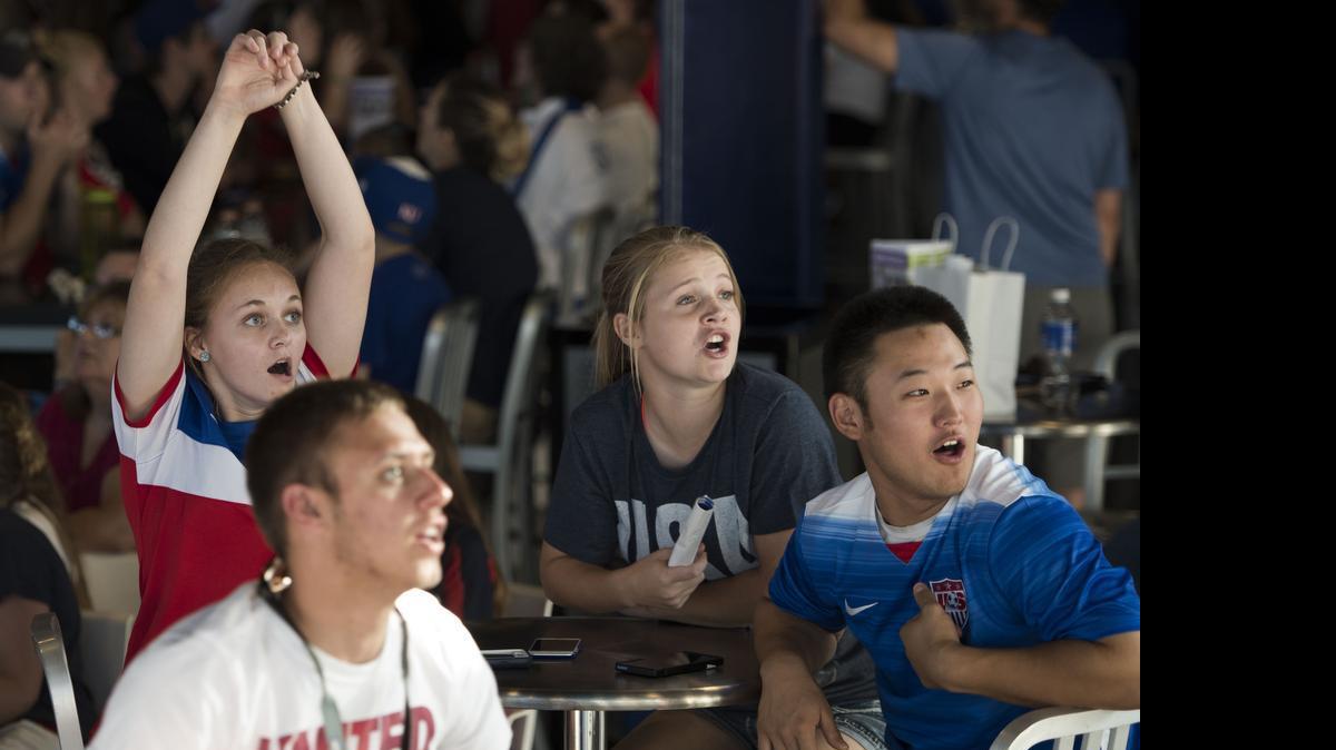 
Emily Pasberg (left), 17, of Liberty, Madeline Hensley, 16, of Liberty and Quentin Willett, 18, of Kansas City, react as team USA misses a shot on goal during a watch party at Sporting Park on Monday, June 8, 2015, in Kansas City, Kansas for the United States Women's National Team World Cup match vs. Australia.

