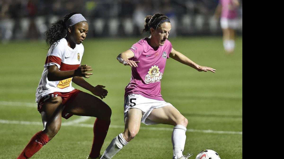
Liz Bogus (right) of FCKC went for the ball against Western New York’s Jamia Fields earlier this season at the Swope Soccer Village.
