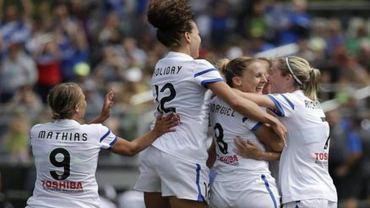 
FC Kansas City players celebrated after scoring a goal in the NWSL championship game against the Seattle Reign.

