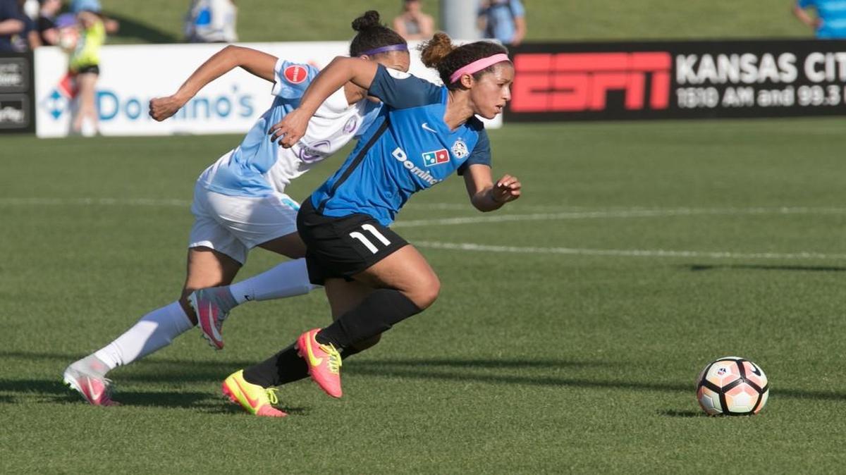 Desiree Scott of FC Kansas City pushes past her opponent during a recent match at Swope Soccer Village.