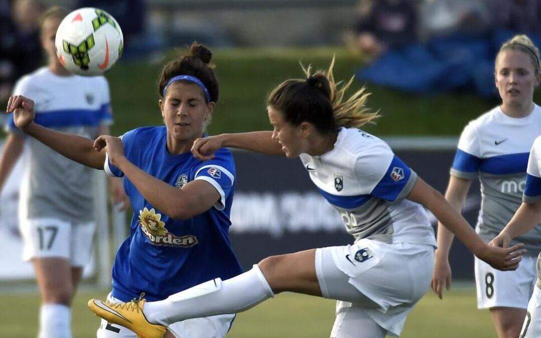 
FC Kansas City forward Sarah Hagen (22) tried to block Seattle Reign FC defender Lauren Barnes (3) from passing the ball in the first half during Thursday’s soccer game at Swope Soccer Village in Kansas City.
