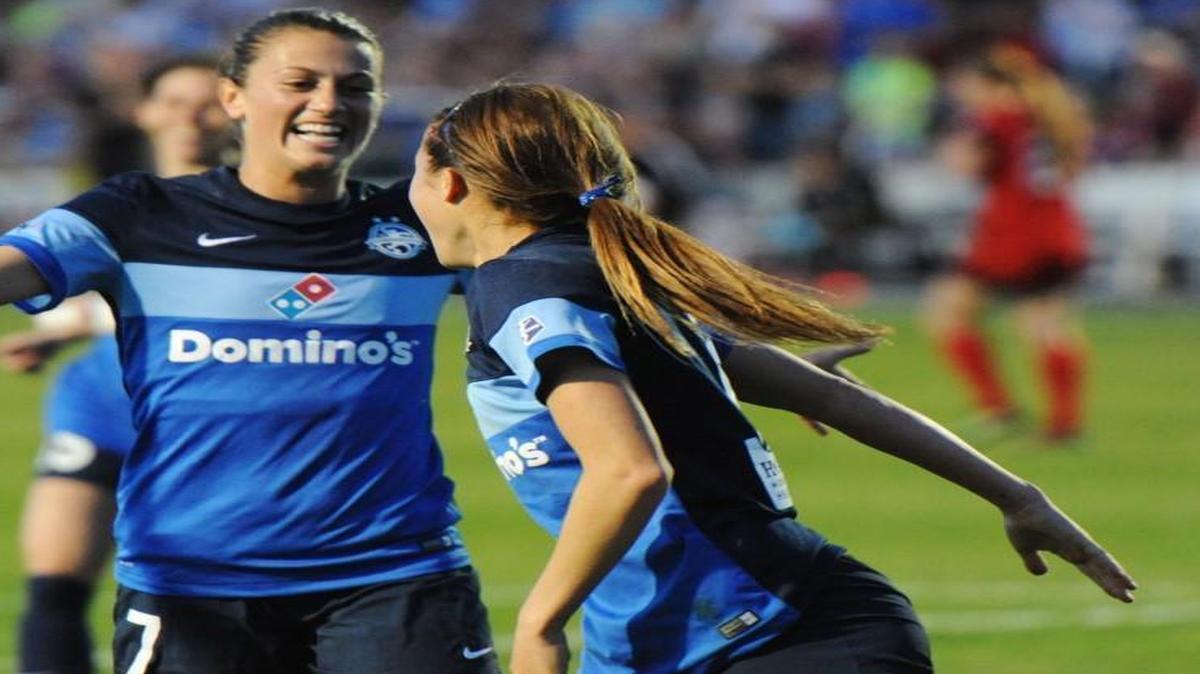 Shea Groom (right) was greeted by FC Kansas City teammate Mandy Laddish to celebrate Groom’s first-half goal against the Portland Thorns on Saturday night at Swope Soccer Village. FCKC lead 1-0 at the end of the first half.