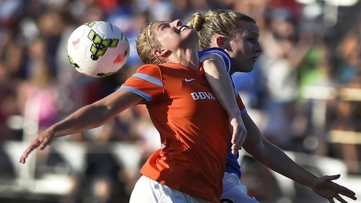 
FCKC’s Amy Rodriguez (right) battled Houston’s Ellie Brush for a header during a game earlier this season at Swope Soccer Village.
