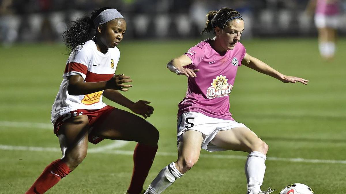 
Liz Bogus (5) of FCKC tries to get the ball away from WNY's Jamia Fields in the second half. FC Kansas City tied Western NY Flash, final 0-0, at the Swope Soccer Village Thursday, May 14, 2015.
